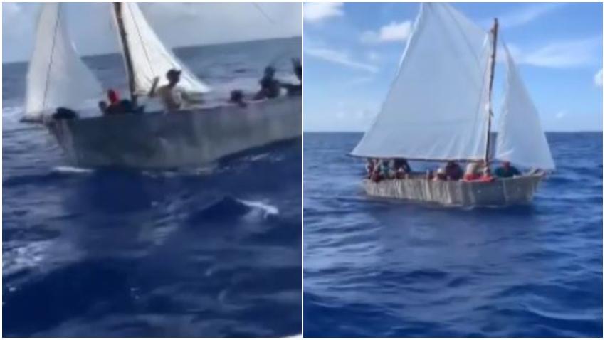 Navegantes ayudan con agua a balseros cubanos que se encontraban cerca de Miami Beach