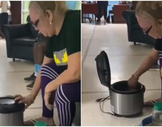 Video viral de una cubana que a falta de corriente en su casa se dirige con su olla eléctrica para cocinar en la sede del PCC de su provincia